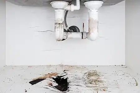 Damage caused by water leak from sink